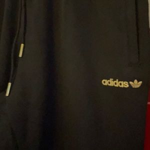Gold lettering    leaf emblem adidas
